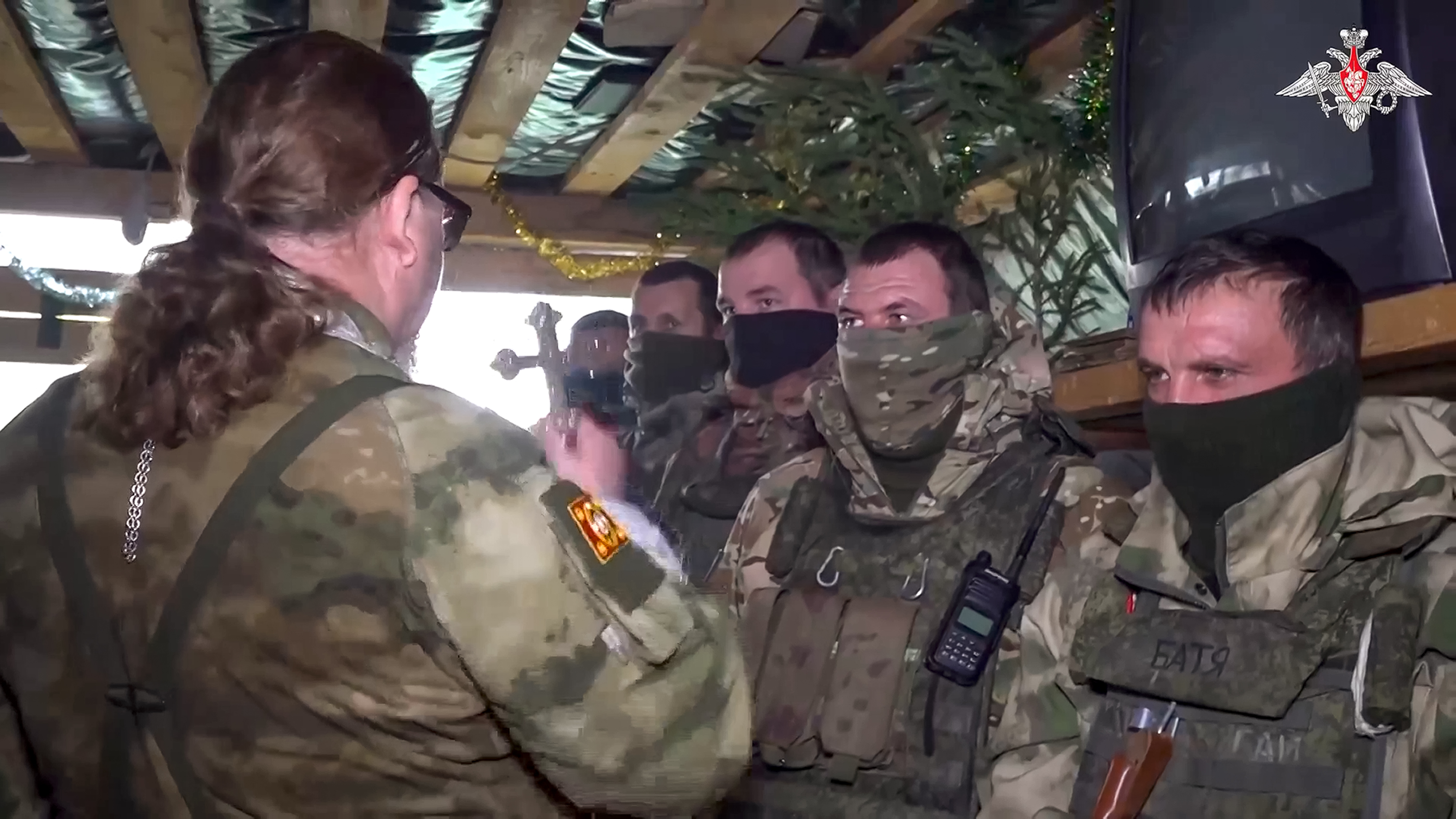 In this photo taken from a video released by the Russian Defense Ministry Press Service on Sunday, Jan. 7, 2024, A Russian Orthodox Church priest conducts an Orthodox Christmas service for servicemen on a mission during a special military operation in Ukraine. (Russian Defense Ministry Press Service via AP)