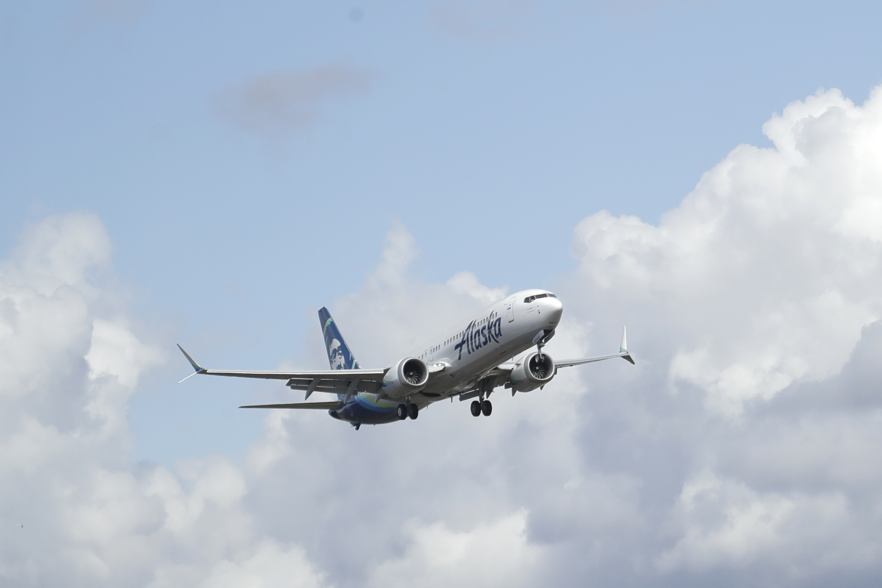 FILE - An Alaska Airlines Boeing 737-9 Max flies above Paine Field near Boeing's manufacturing facility in Everett, Wash., Monday, March 23, 2020, north of Seattle. A window panel blew out on a similar Alaska Airlines Boeing 737-9 Max seven minutes after takeoff from Portland, Ore., on Friday, Jan. 5, 2023. (AP Photo/Ted S. Warren, File)