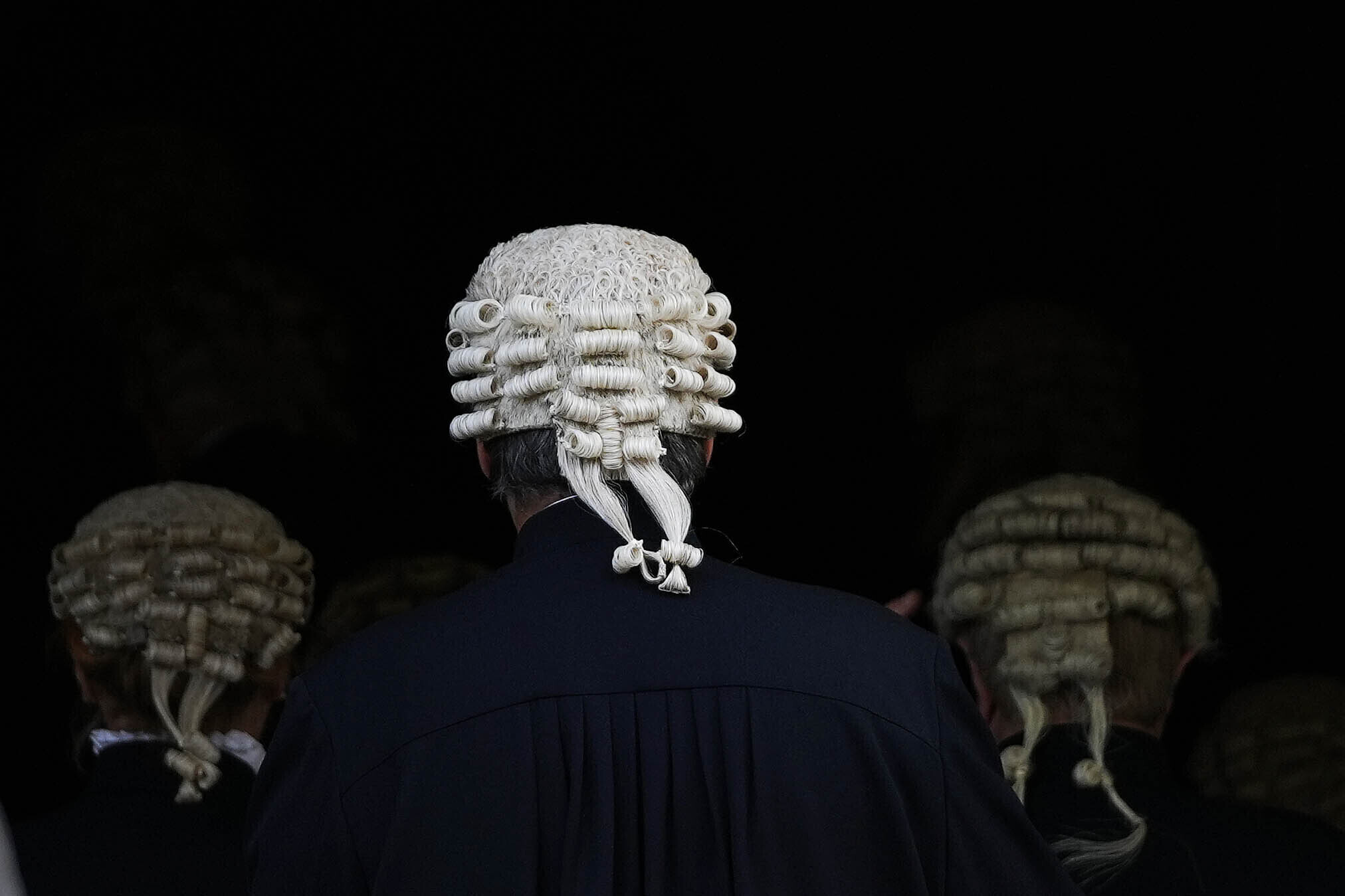 FILE - Judges walk into Parliament after a Service at Westminster Abbey for the opening of the new legal year in London, Friday, Oct. 1, 2021. Judges in England and Wales have been given approval to use artificial intelligence to help writing legal opinions. The judiciary issued its first guidance last month on the use of AI. The step puts the courts at the forefront of legal systems grappling with how to regulate AI. (AP Photo/Frank Augstein, File)